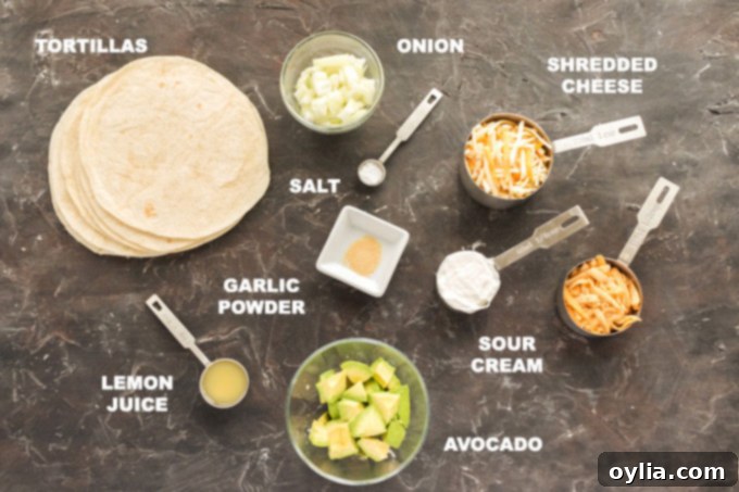 Fresh ingredients laid out for making Quesados, including tortillas, avocados, cheeses, and spices