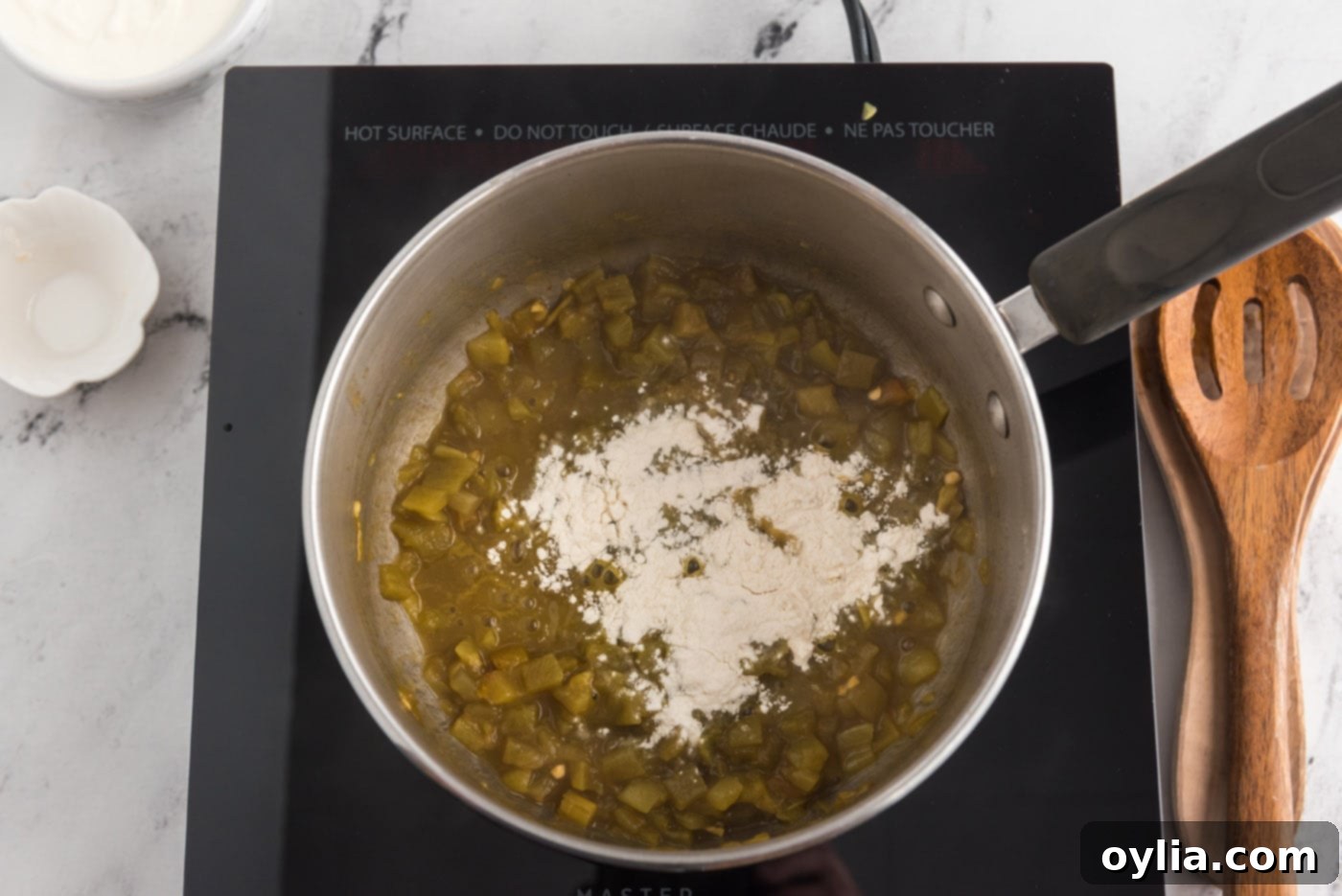 Green chiles cooking in a saucepan
