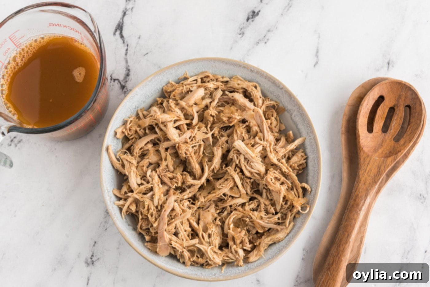 Shredded chicken mixture in a bowl, ready for the next step