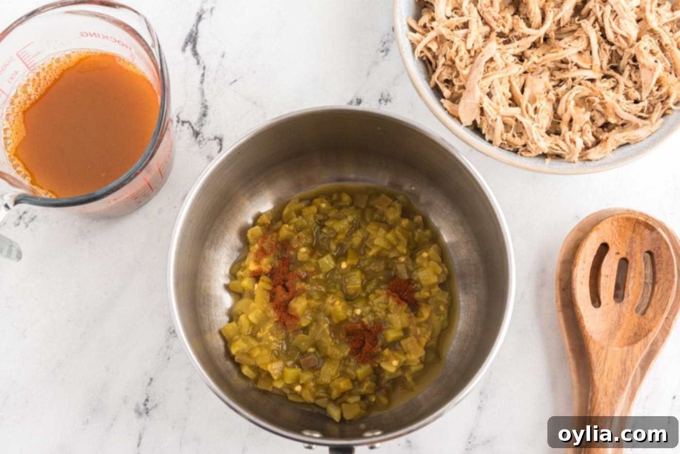 Green chiles and chili powder in a bowl