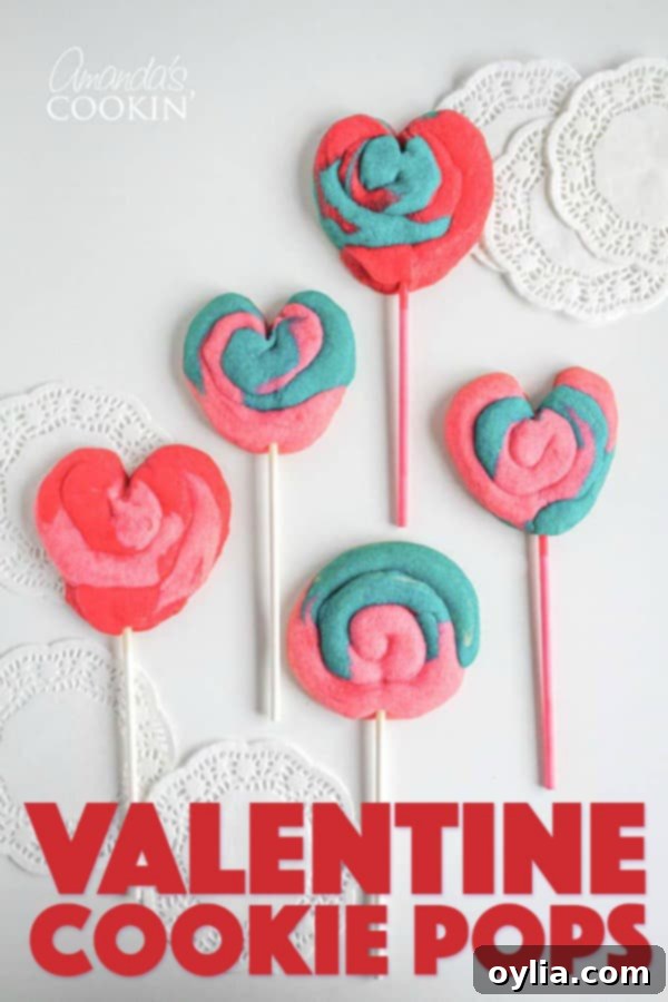 Pinterest-friendly image of heart-shaped Valentine's Day Cookie Pops, adorned with colorful swirls, perfect for sharing and pinning