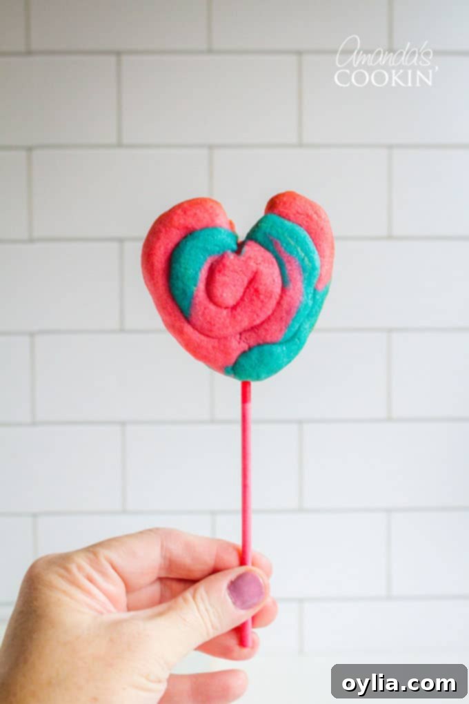 A vibrant display of completed Valentine Play Dough Cookie Pops, arranged artfully and ready for enjoyment