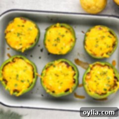 Overhead photo of Chili and Cornbread Stuffed Peppers in a pan, ready to be served