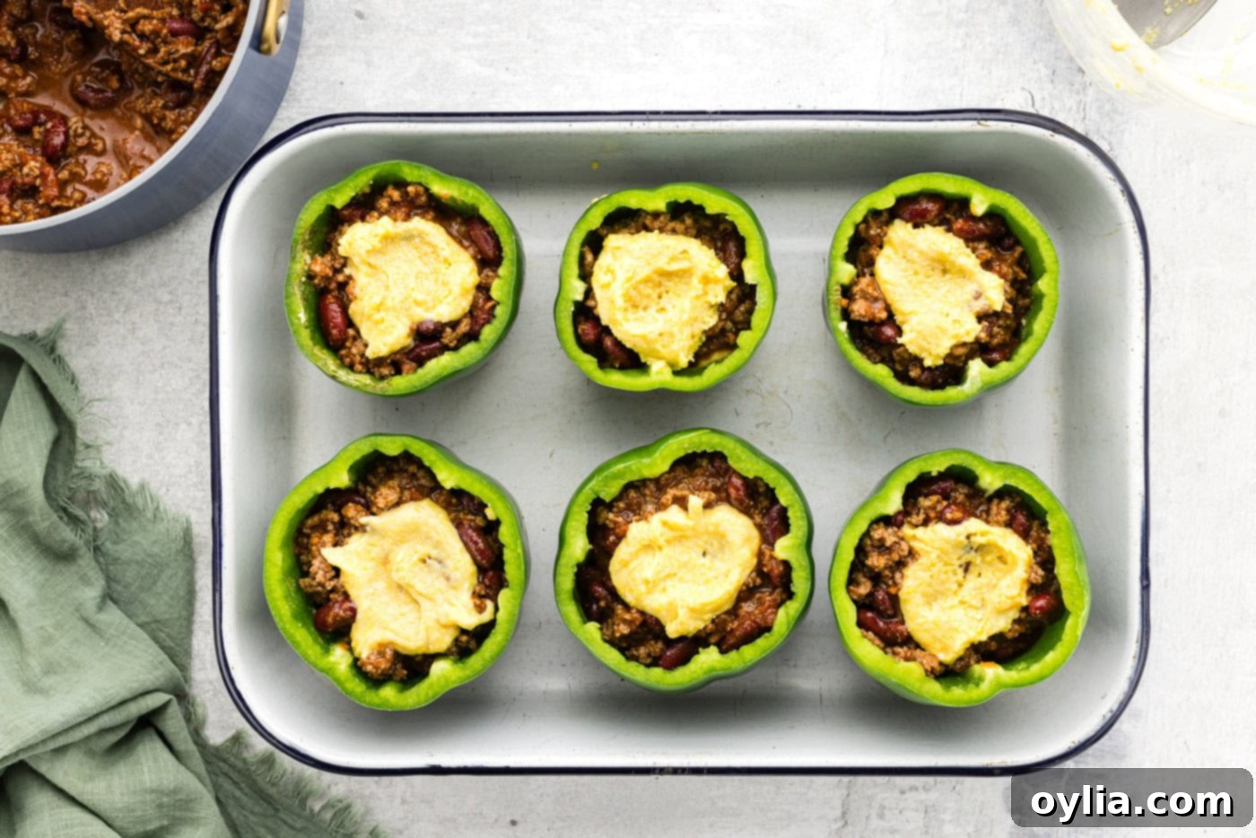 cornbread batter on top of stuffed peppers