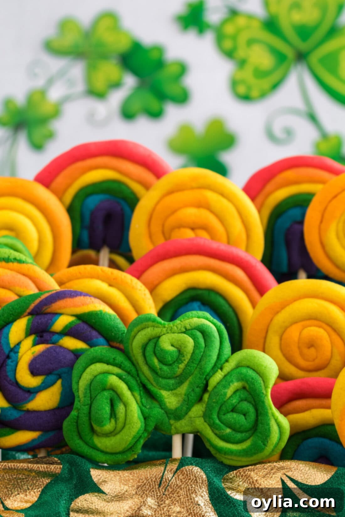 Close up photo of beautifully decorated St. Patrick’s Day Cookies, including rainbows, shamrocks, and gold coins.