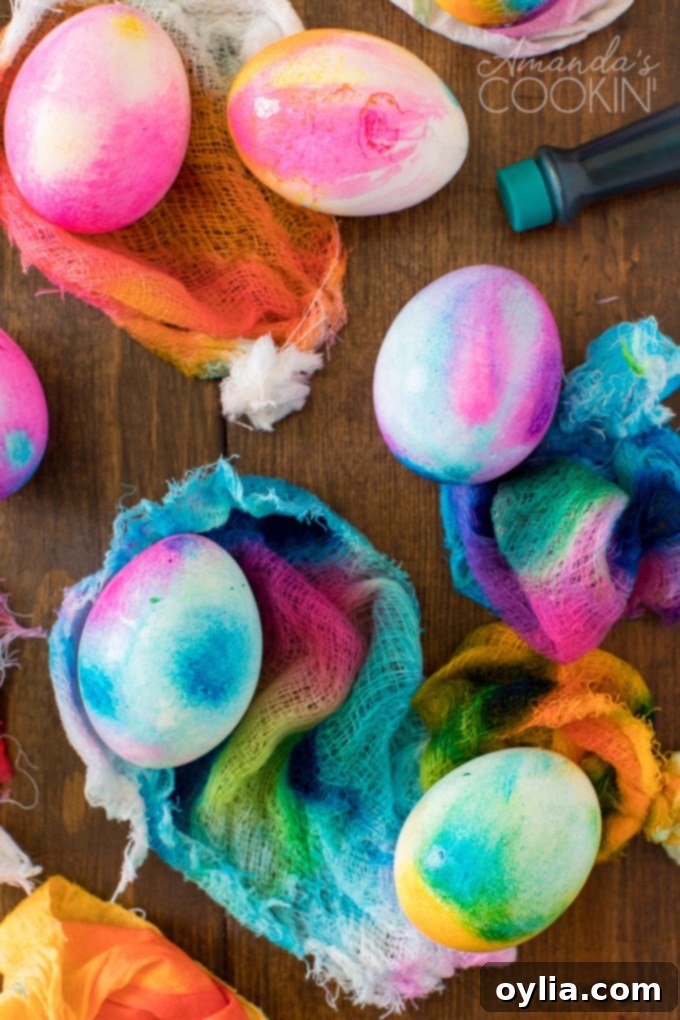 Hard-boiled eggs wrapped in damp cheesecloth, gathered and secured with rubber bands, ready for tie-dye application