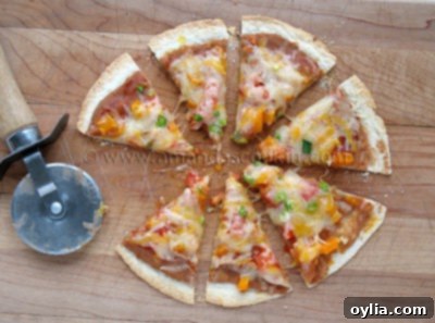 Delicious Easy Mexican Tortilla Appetizers, perfectly baked and ready to serve on a white plate with fresh ingredients scattered around.