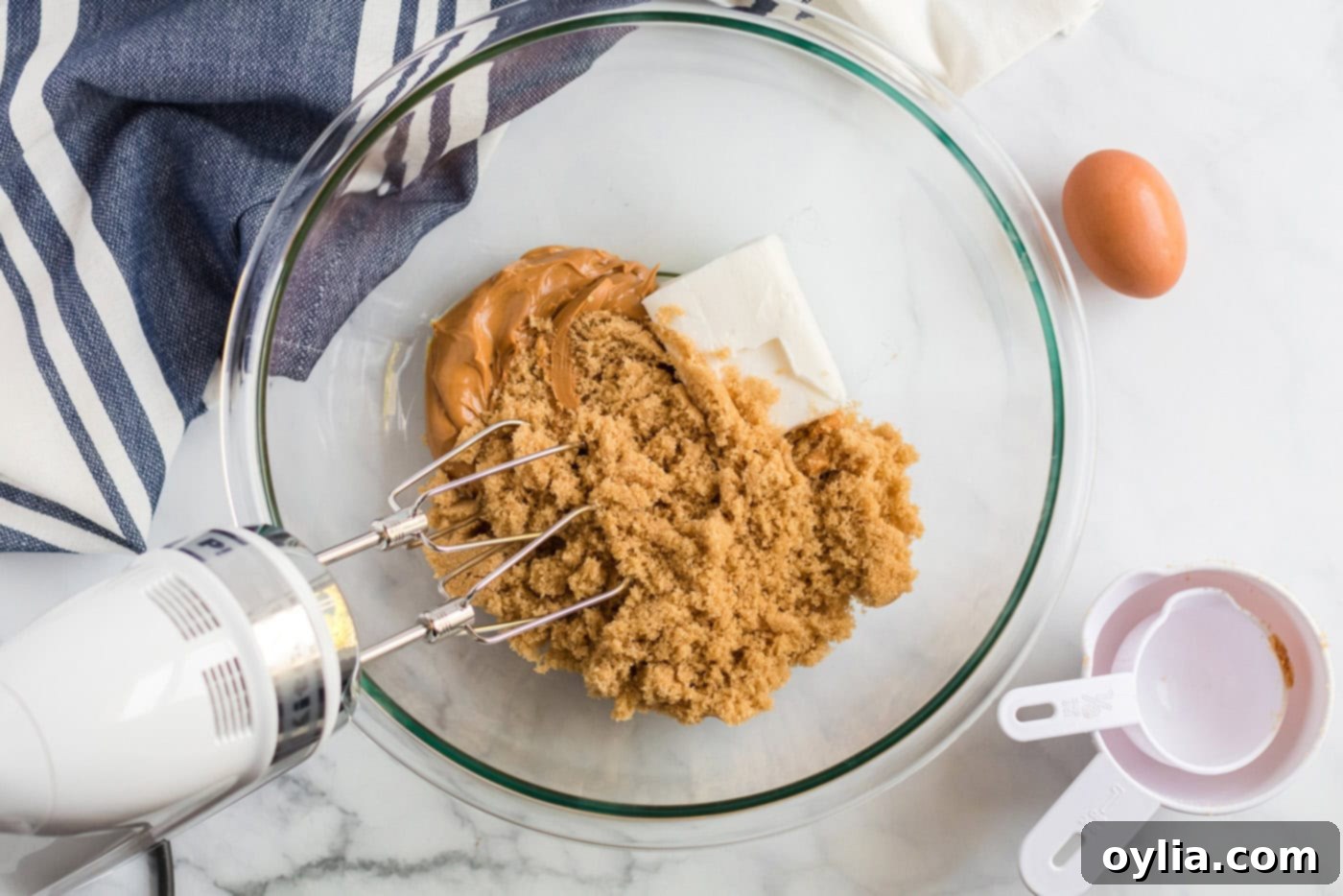 Shortening, peanut butter, brown sugar, milk and vanilla in a mixing bowl
