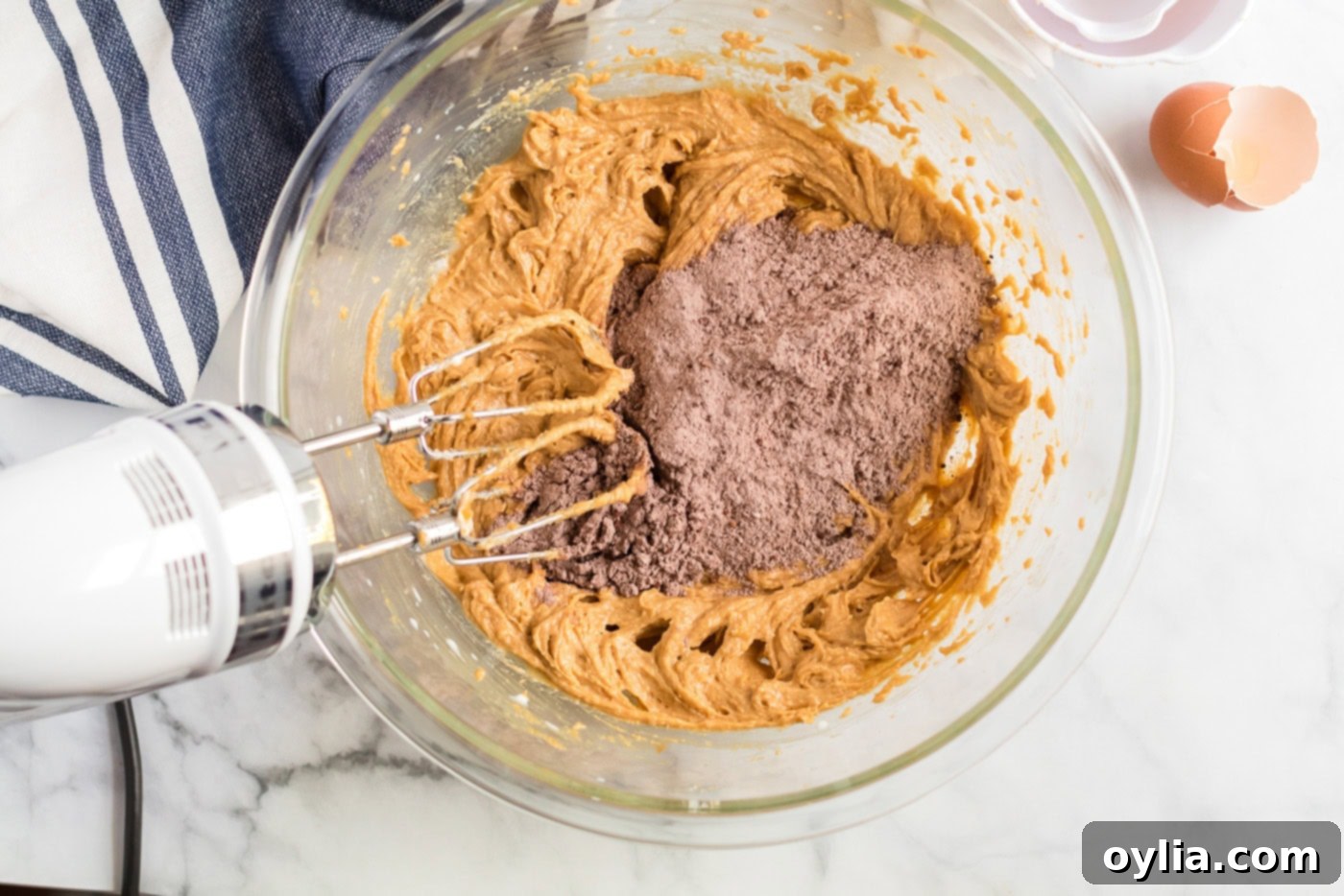 Flour mixture being added to the creamed mixture