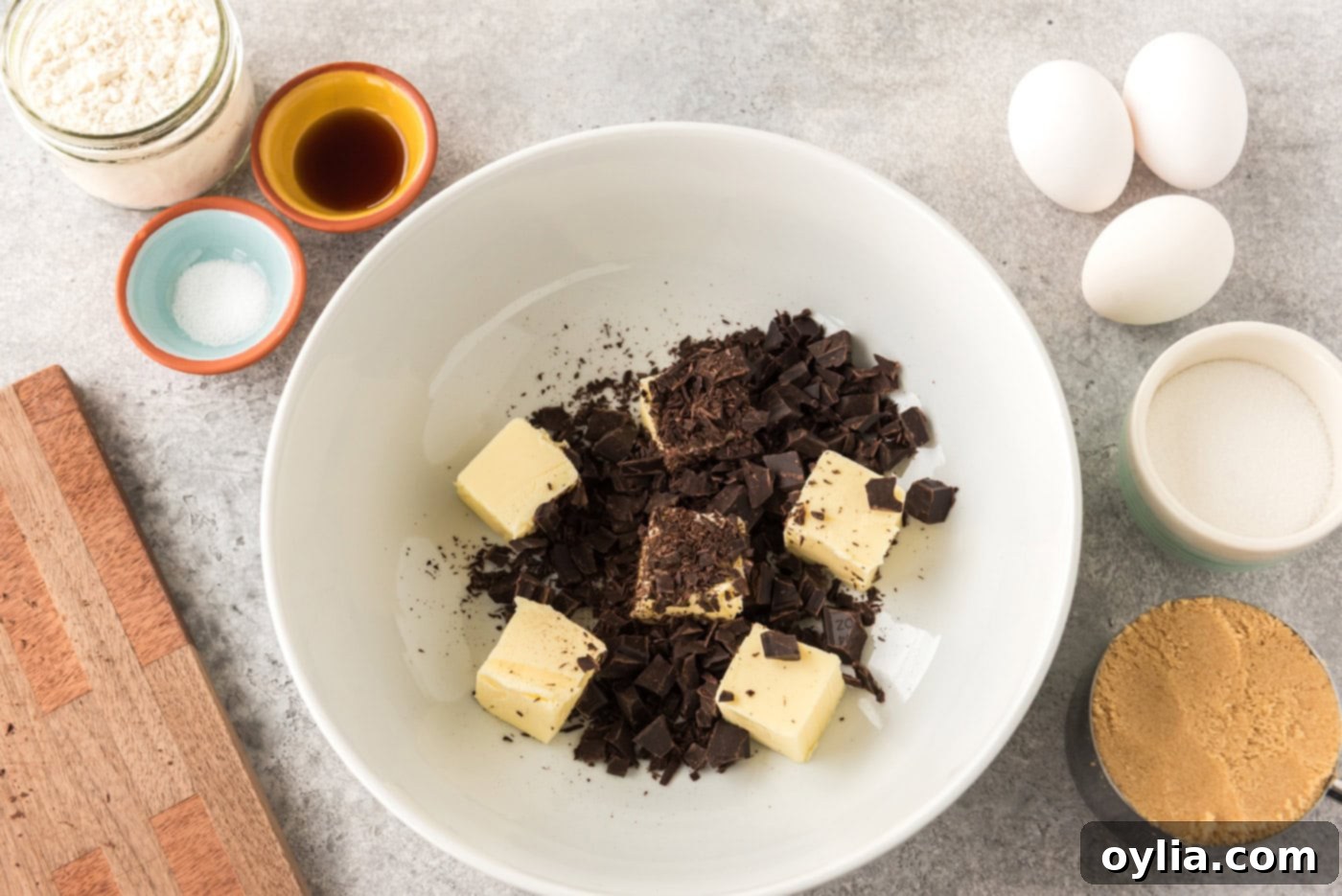 sliced butter pats with chopped chocolate in a bowl