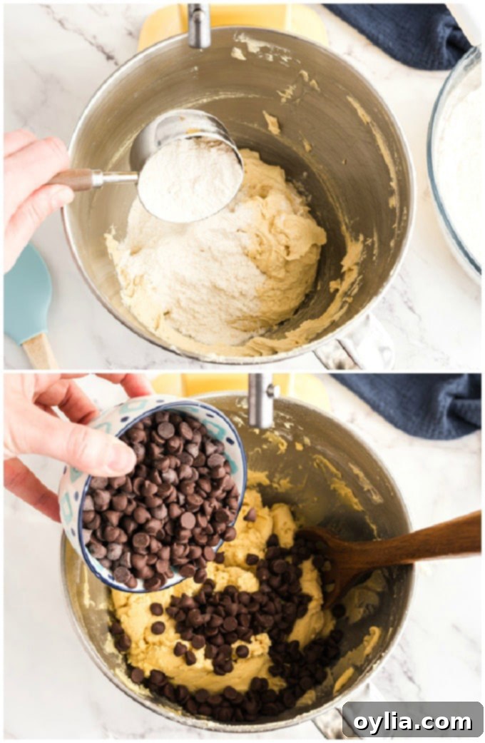 Adding semisweet chocolate chips to the cookie dough in a large bowl, ready for the final mix.