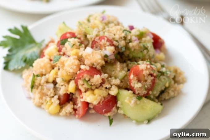 The completed Summer Vegetable Quinoa Salad, perfectly dressed and ready to be chilled.