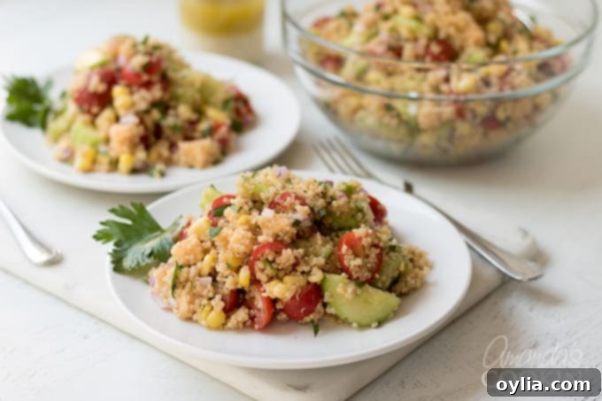 A large bowl of the finished Summer Vegetable Quinoa Salad, brightly colored and inviting.