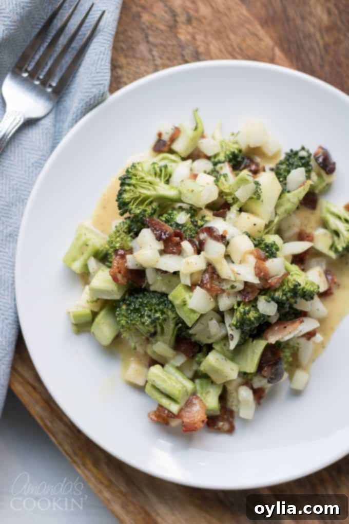 A vibrant green salad featuring mixed greens, cherry tomatoes, and cucumber slices.