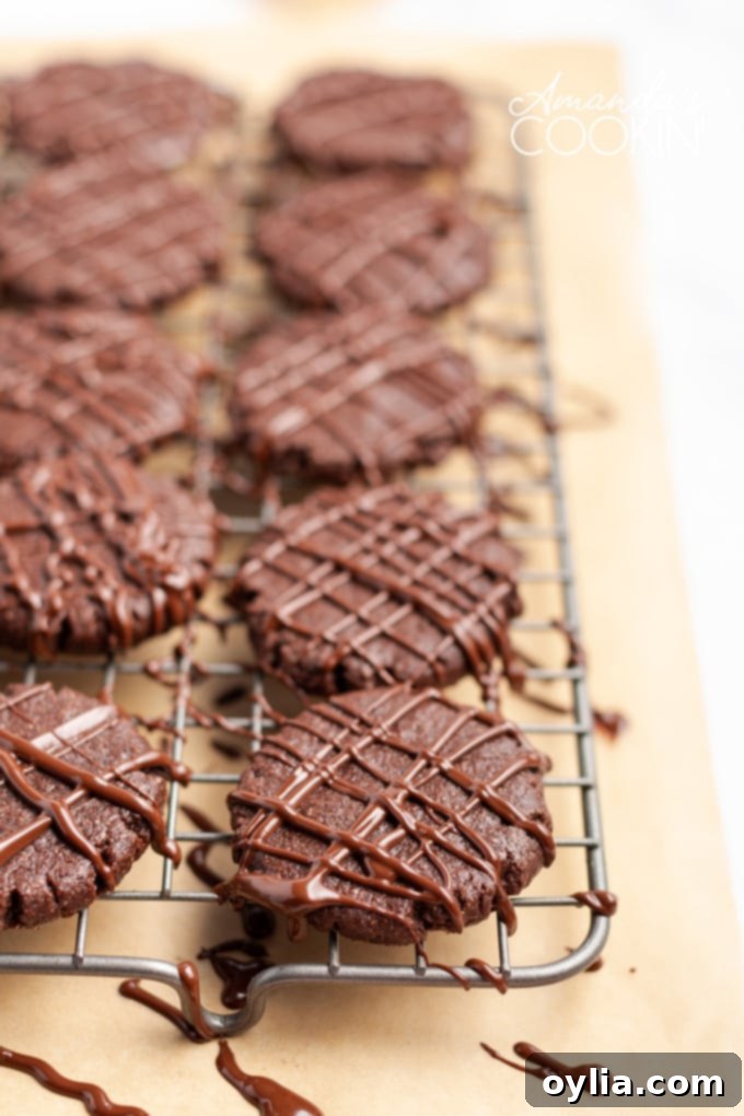 wire rack of chocolate mint cookies drizzled with melted chocolate