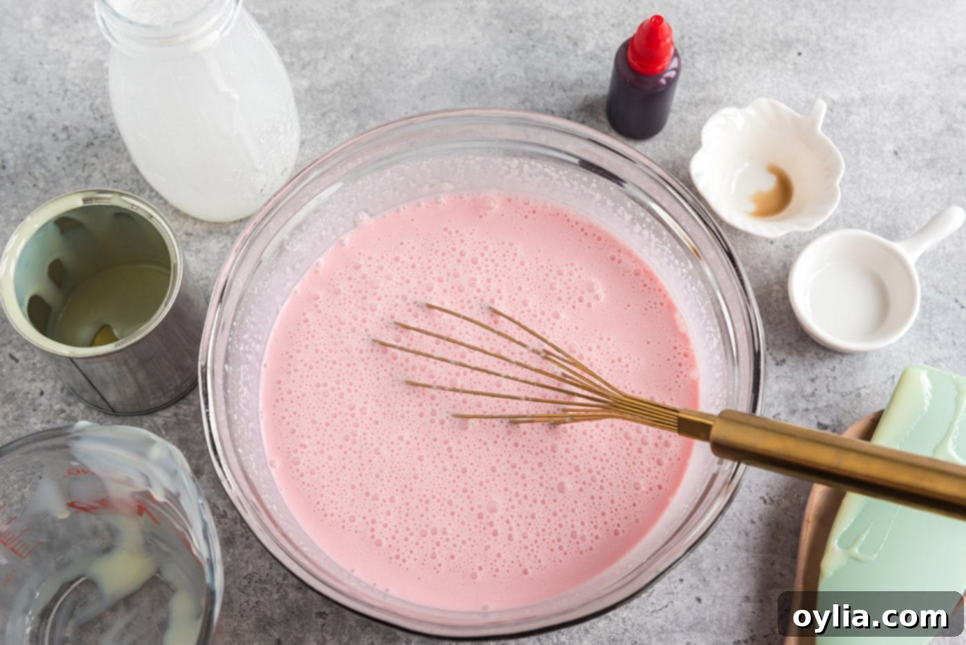 Whisking all liquid ice cream ingredients together in a bowl until smooth and well combined.