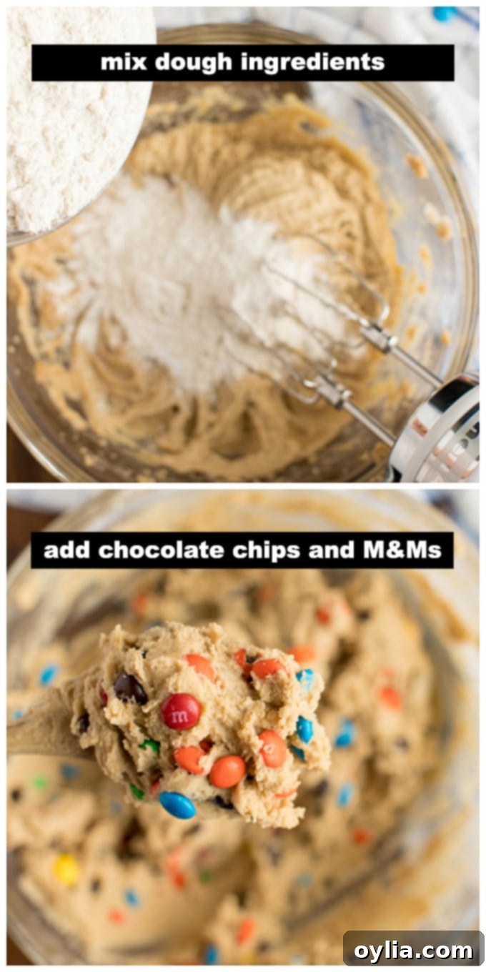 Cookie dough being mixed in a bowl, showing the combination of wet and dry ingredients with chocolate chips and M&Ms.
