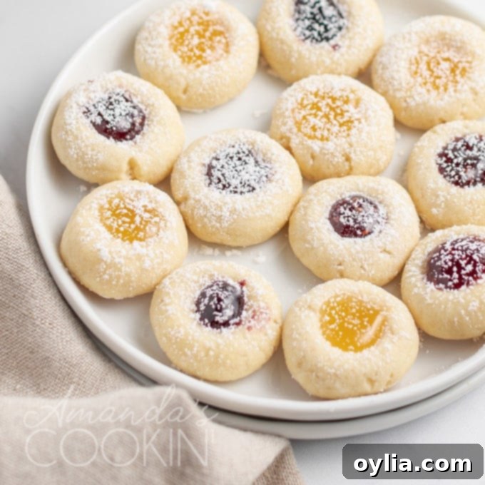 thumbprint cookies with jam centers on a plate