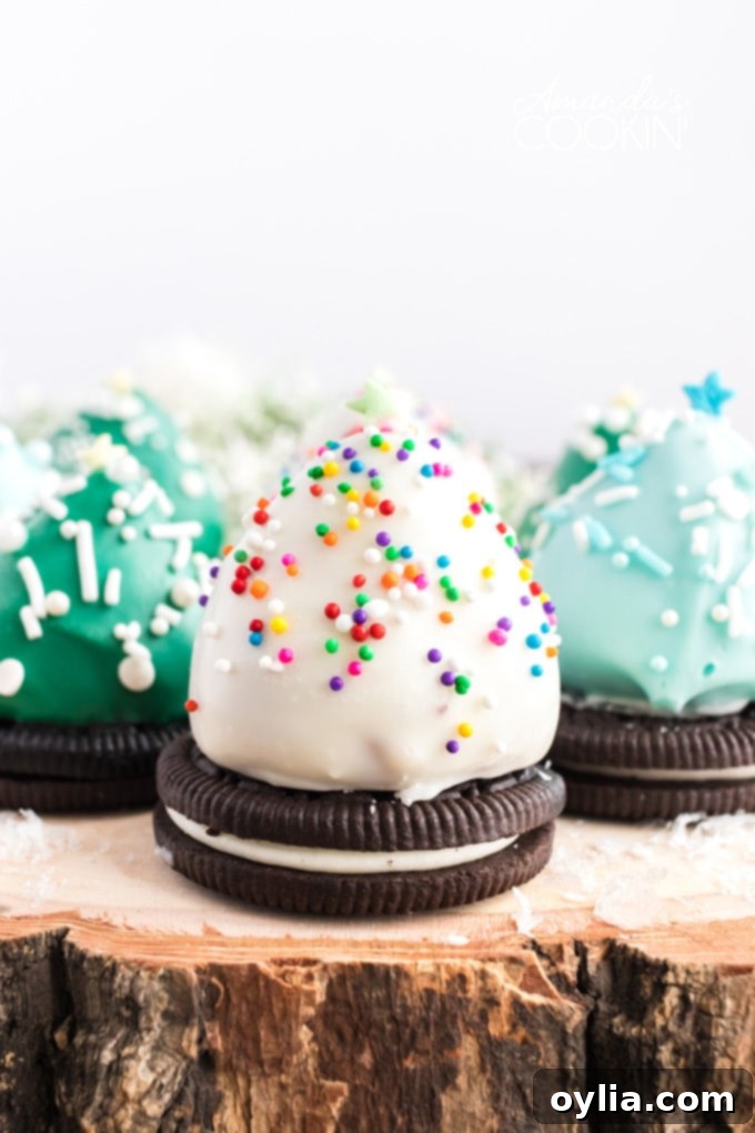 Festive chocolate covered strawberry Christmas trees on a rustic wood platter, ready for holiday celebrations.