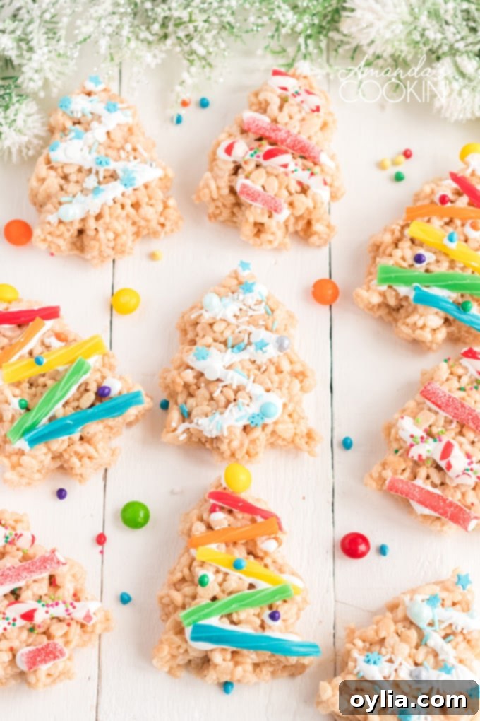 rice krispie treats shaped like christmas trees, decorated for the holidays