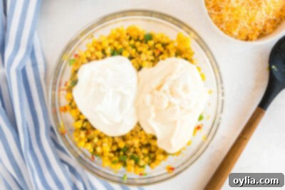 bowl of corn with mayo and sour cream added