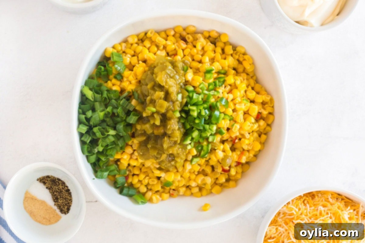 bowl of corn with green chiles, jalapeno, and green onion added