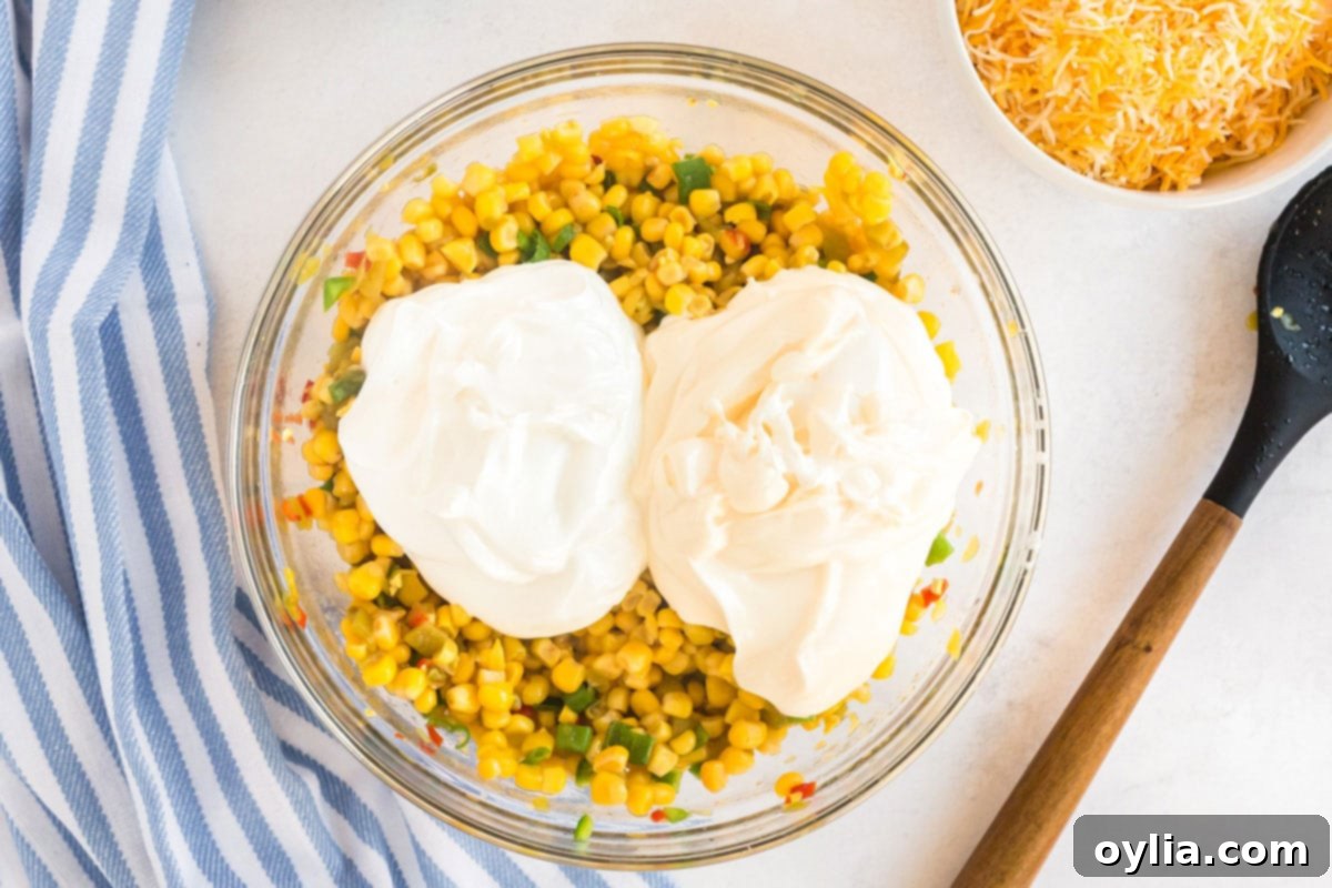 bowl of corn with mayo and sour cream added