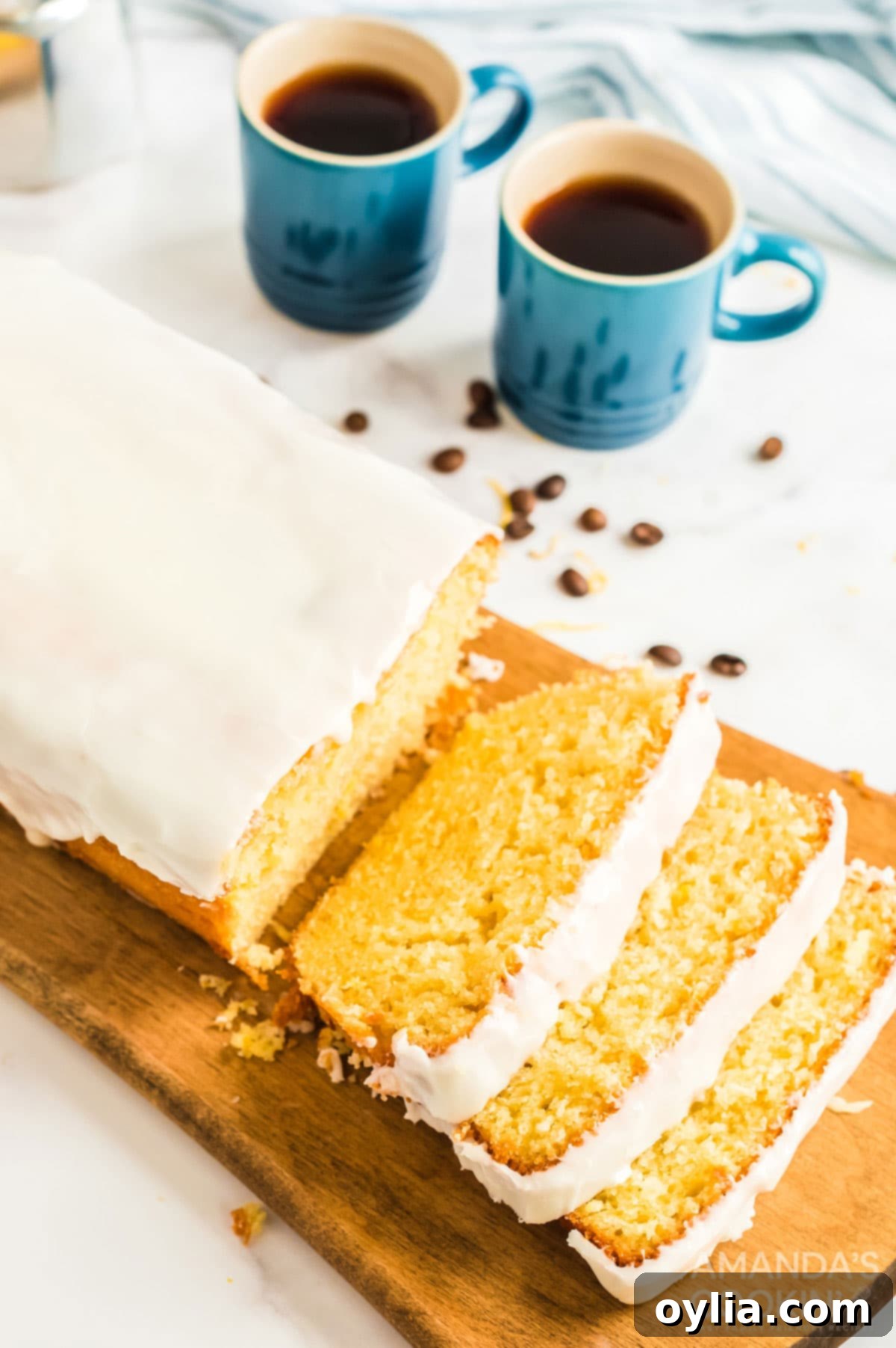 sliced lemon loaf on a cutting board, perfectly glazed and ready to eat, a true copycat of Starbucks' popular treat