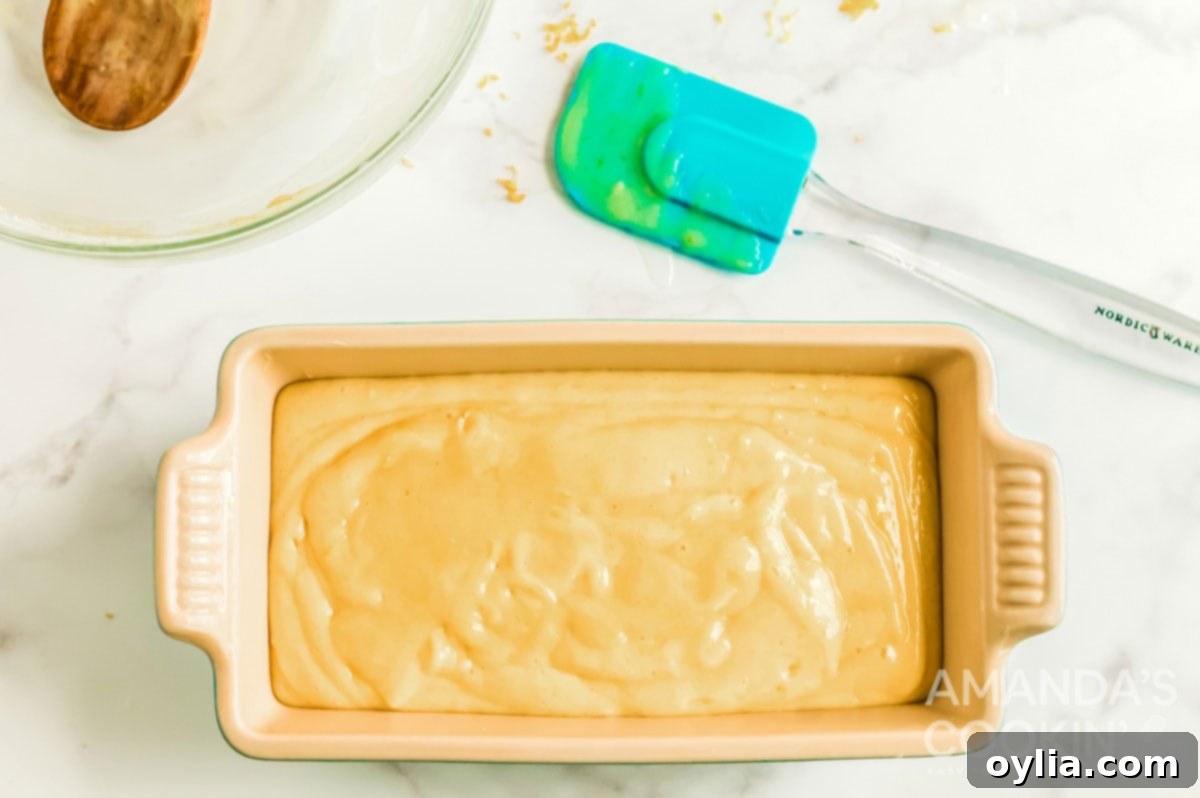 batter in a loaf pan, ready for baking