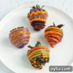 Spooky Strawberry Treats 2 HALLOWEEN THEMED CHOCOLATE COVERED STRAWBERRIES ON A PLATE