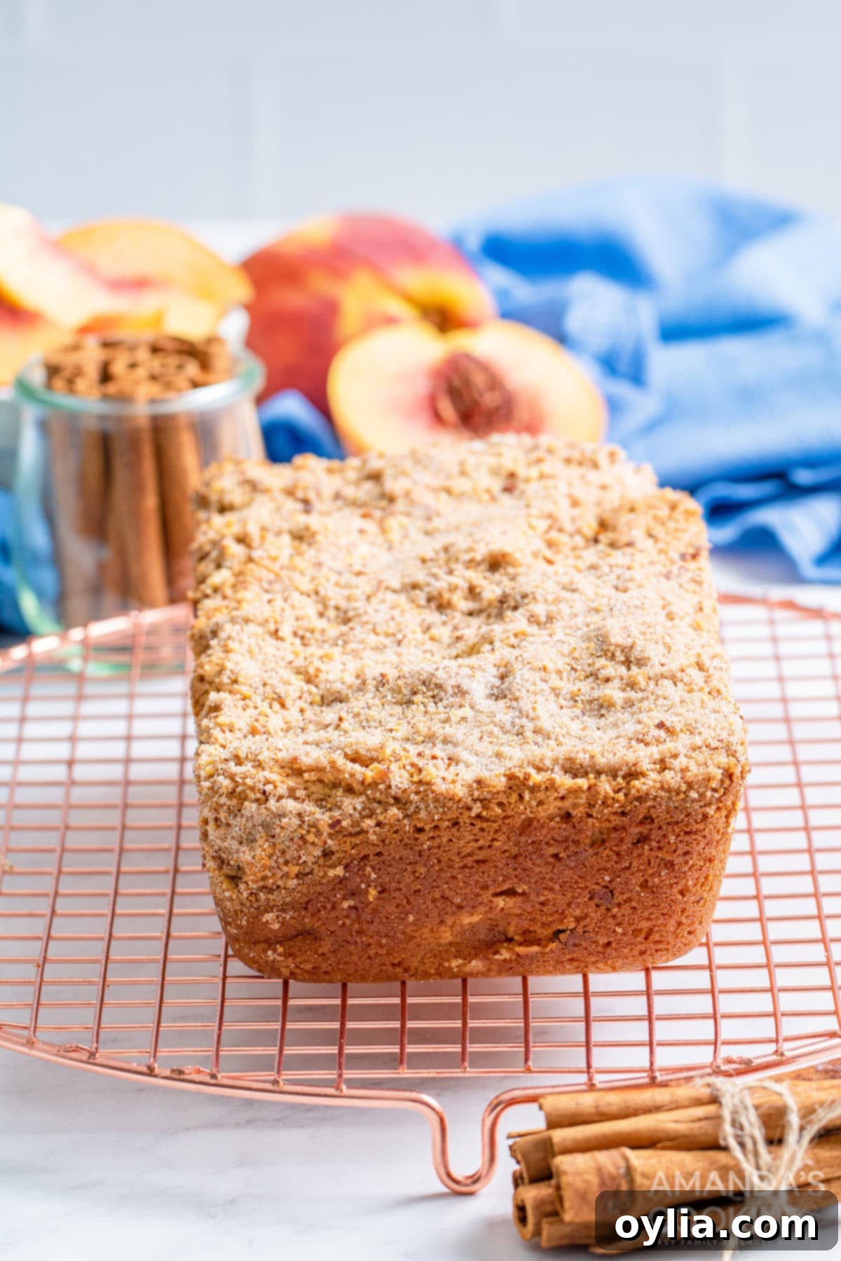 loaf of peach bread on a cooling rack