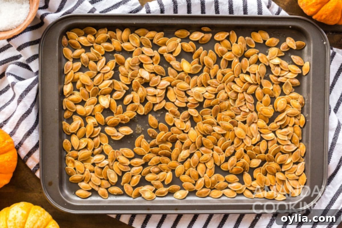 Golden Roasted Pepitas 9 pan full of perfectly roasted pumpkin seeds, golden and crispy.