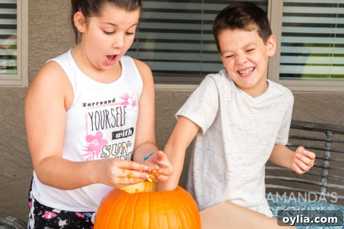 There's something nostalgic about a pan full of salty roasted pumpkin seeds! It's a fall and Halloween tradition after carving pumpkins. kids joyfully cleaning out a pumpkin, extracting seeds for roasting.