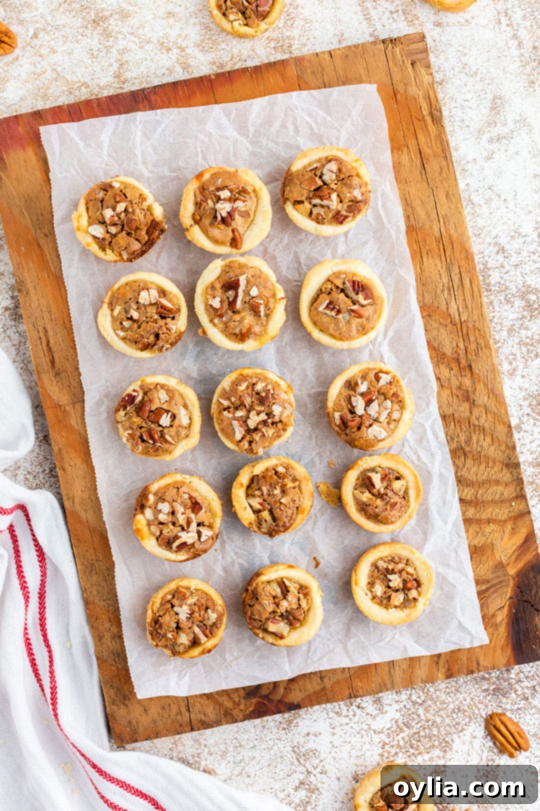 Mini Pecan Pie Perfection 14 pecan tassies on a cutting board