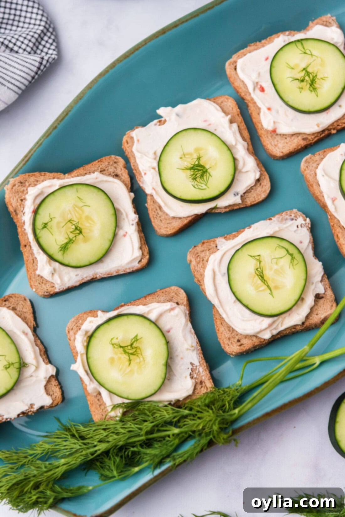 CUCUMBER SANDWICHES ON A BLUE PLATTER