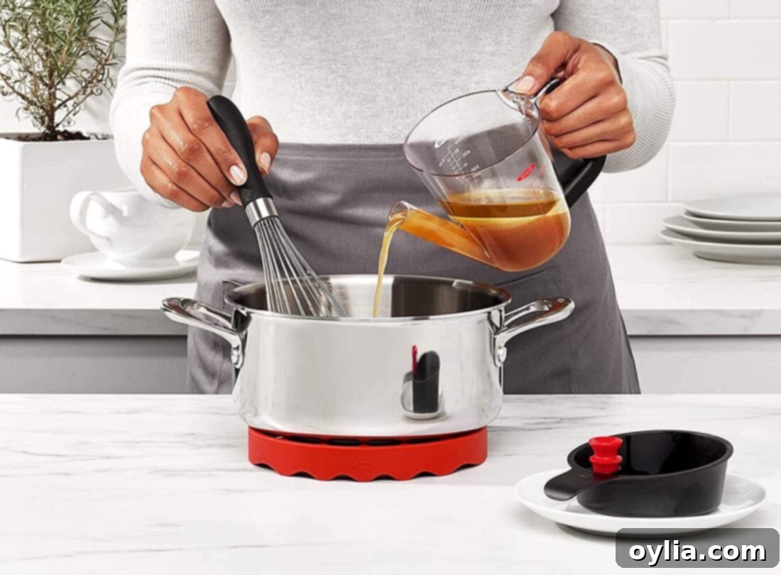 pouring broth from fat separator