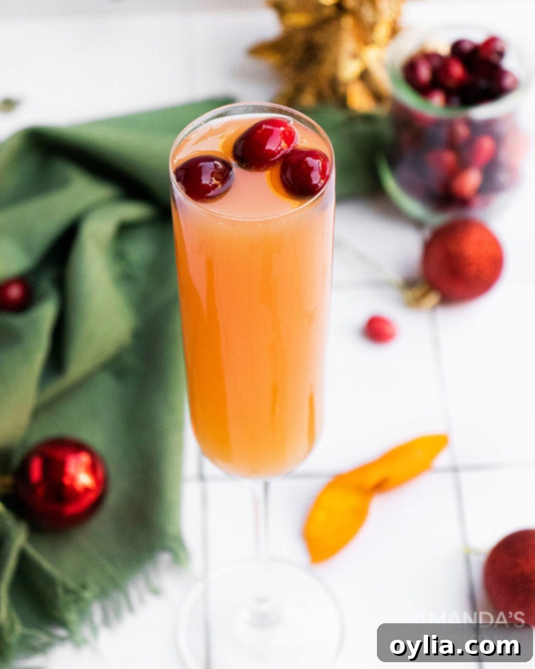 cranberry mimosa with cranberry garnish