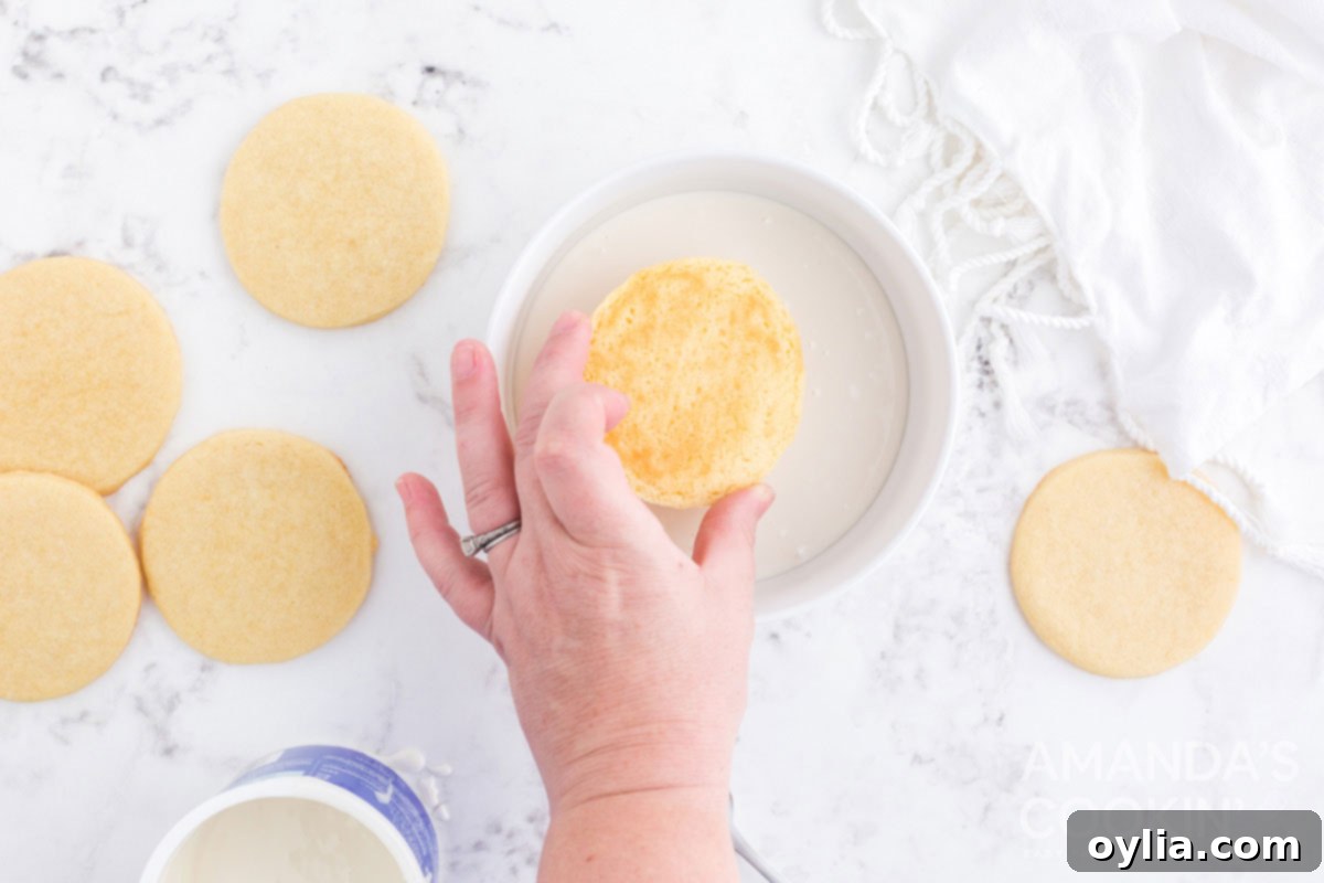 dipping cookie in icing