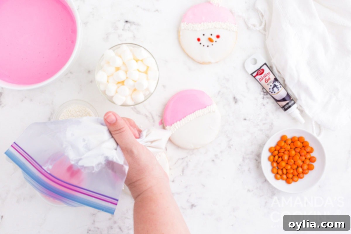 piping icing onto cookie