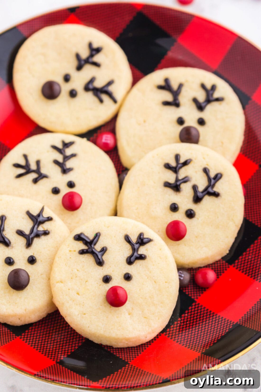 reindeer cookies on a red/black plate