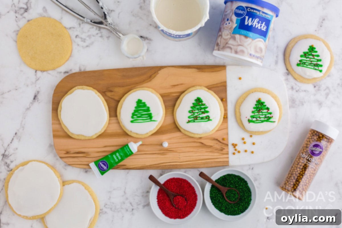 adding christmas trees with decorator gel on iced cookies