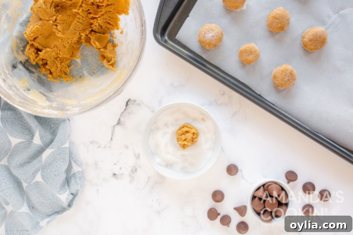 cookie dough balls on baking sheet