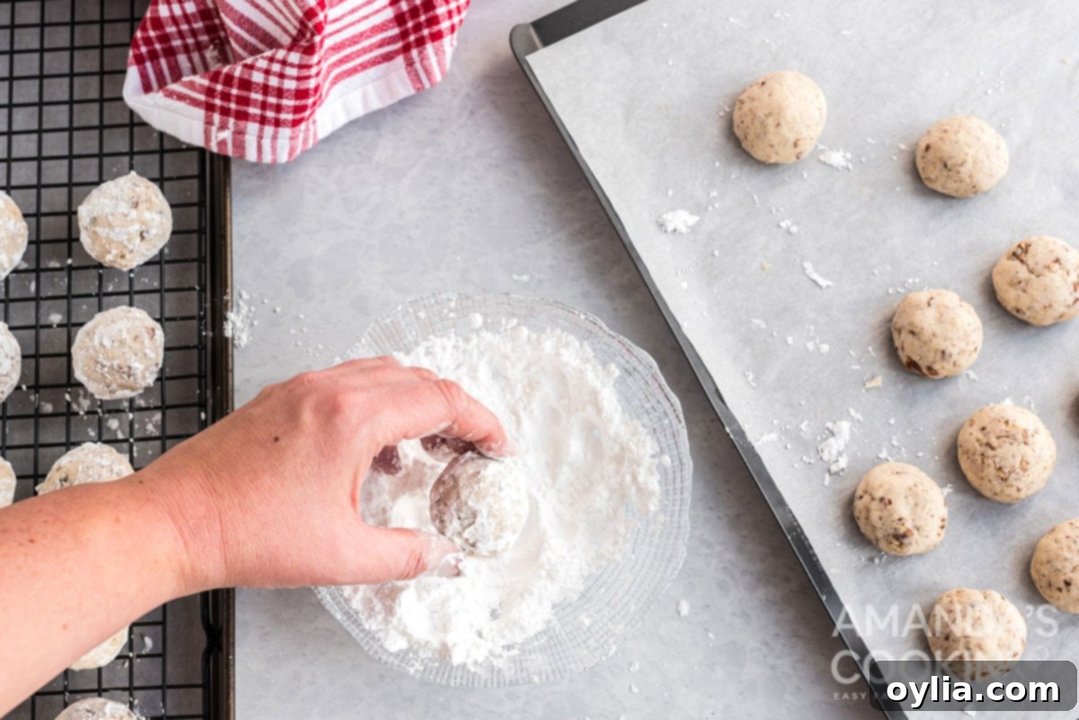 rolling cookies in powdered sugar