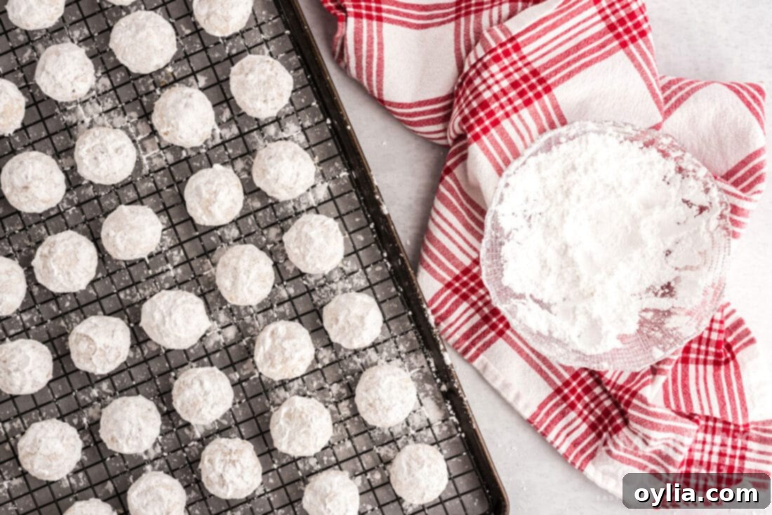 snowball cookies on wire rack