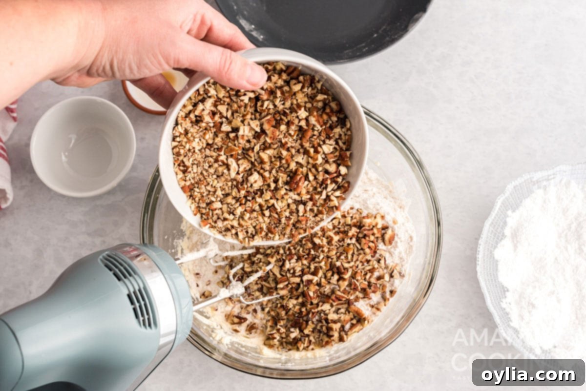 adding pecans to bowl