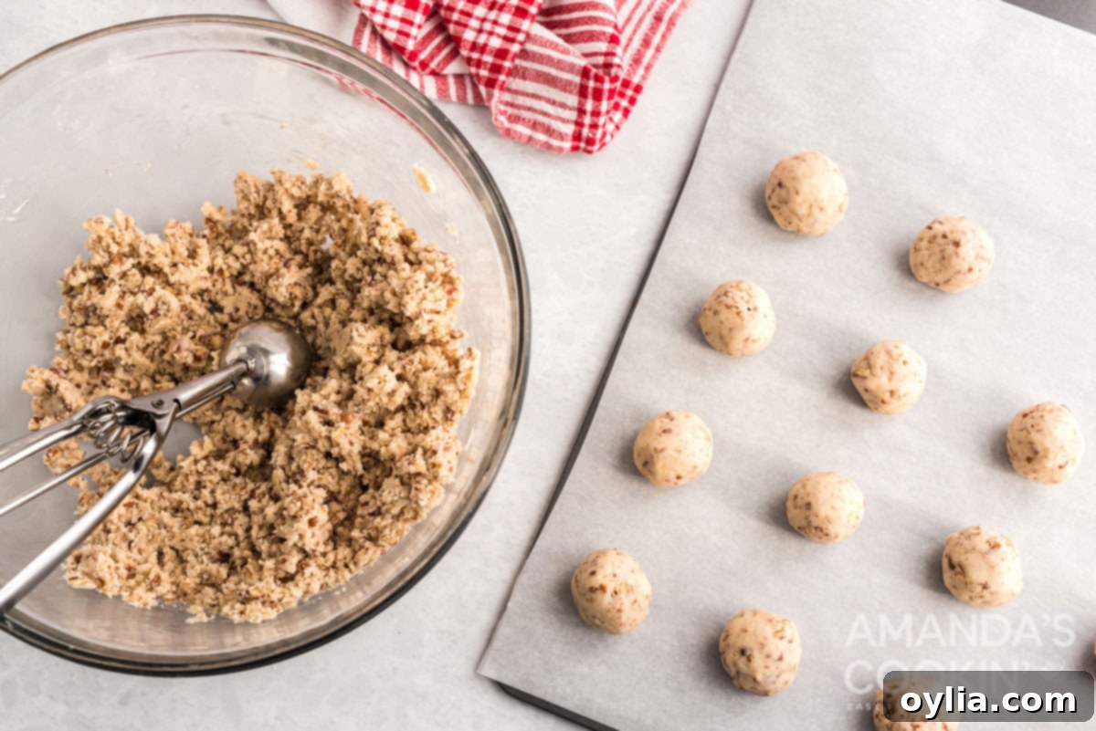 cookie balls on baking sheet