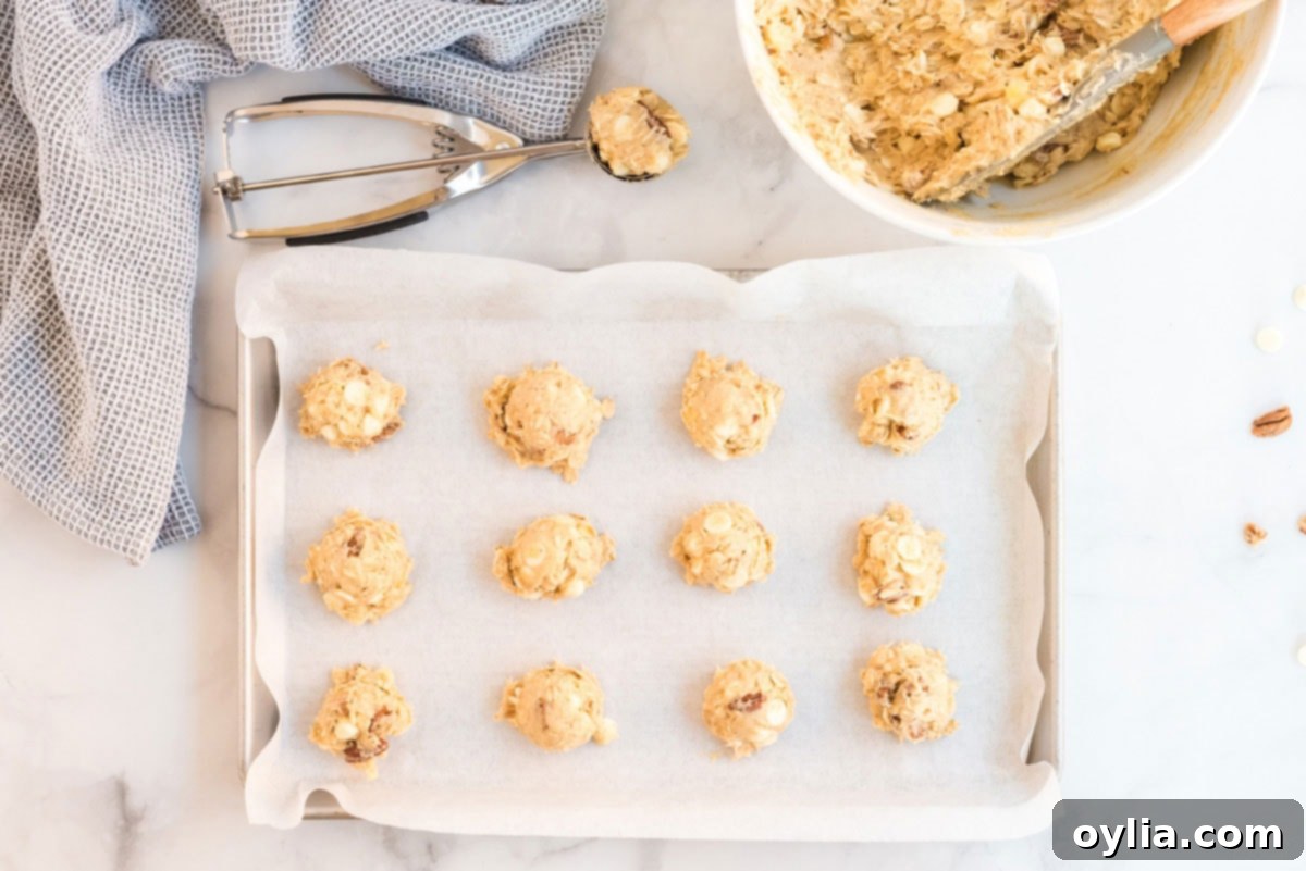 Portioned cookie dough balls on a baking sheet