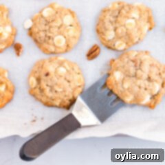 Banana Bliss Bites 14 Two banana cookies with a spatula on a cooling rack