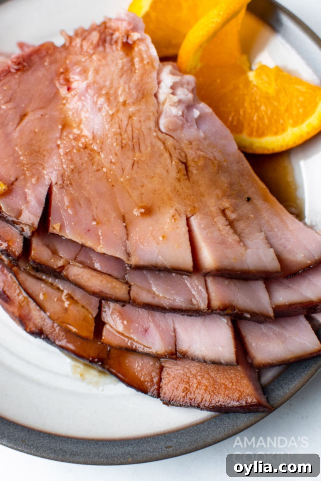 sliced glazed ham on plate