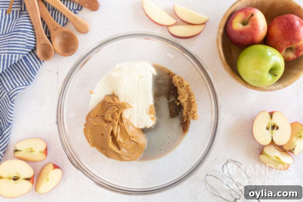 peanut butter and cream cheese in a bowl, ready to be mixed